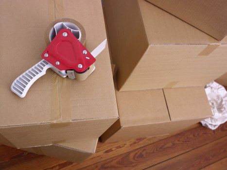 Packed boxes and furniture ready for local removals