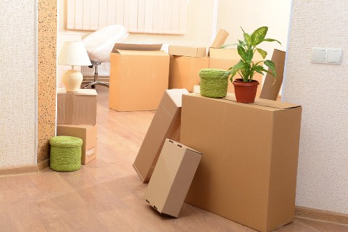 Packed office boxes and furniture ready for a business move