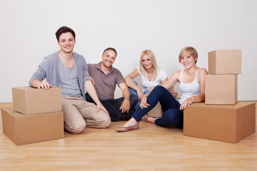 Packed moving boxes and furniture ready for local removals